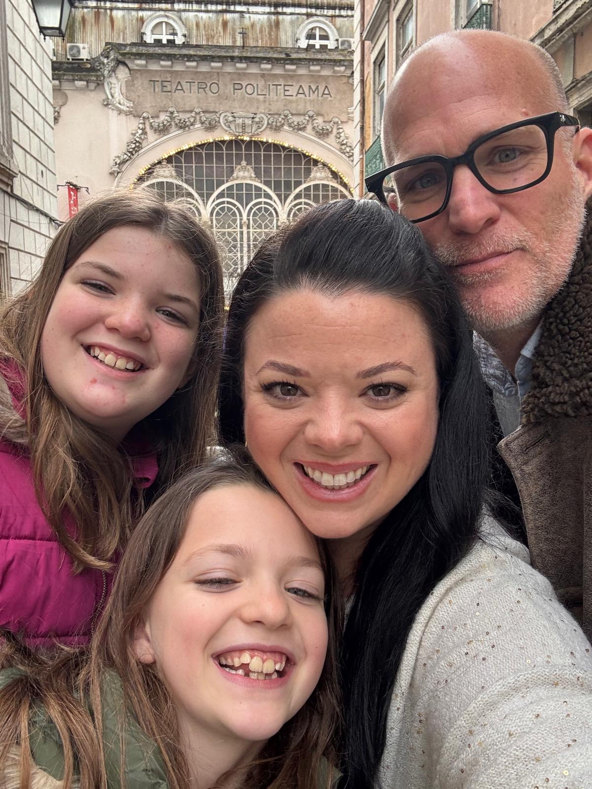 Cassie, Mike and their daughters in front of Teatro Politeama, Lisbon